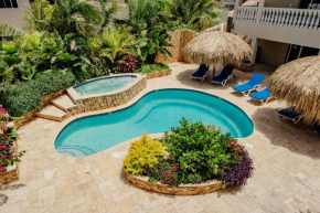 Stunning modern 2-bedroom apartment with tropical garden, pool and jacuzzi